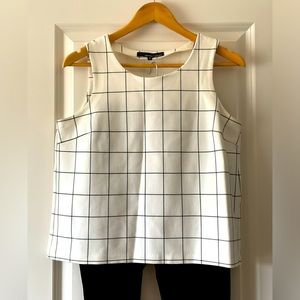 Sleeveless top in cream, black and navy blue.  Bundle any three tops for $10.